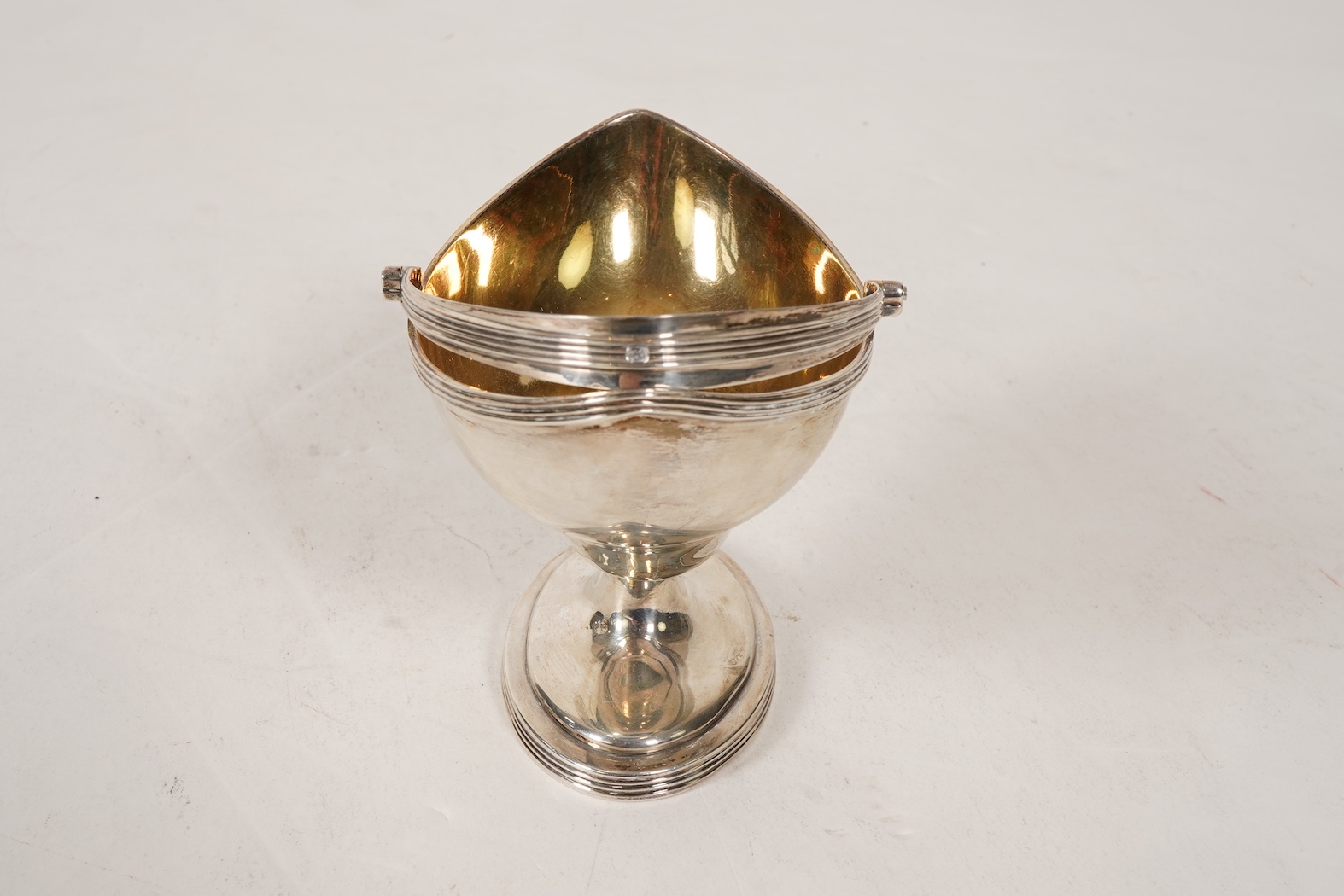 A George III silver boat shaped pedestal sugar basket, by Peter & Ann Bateman